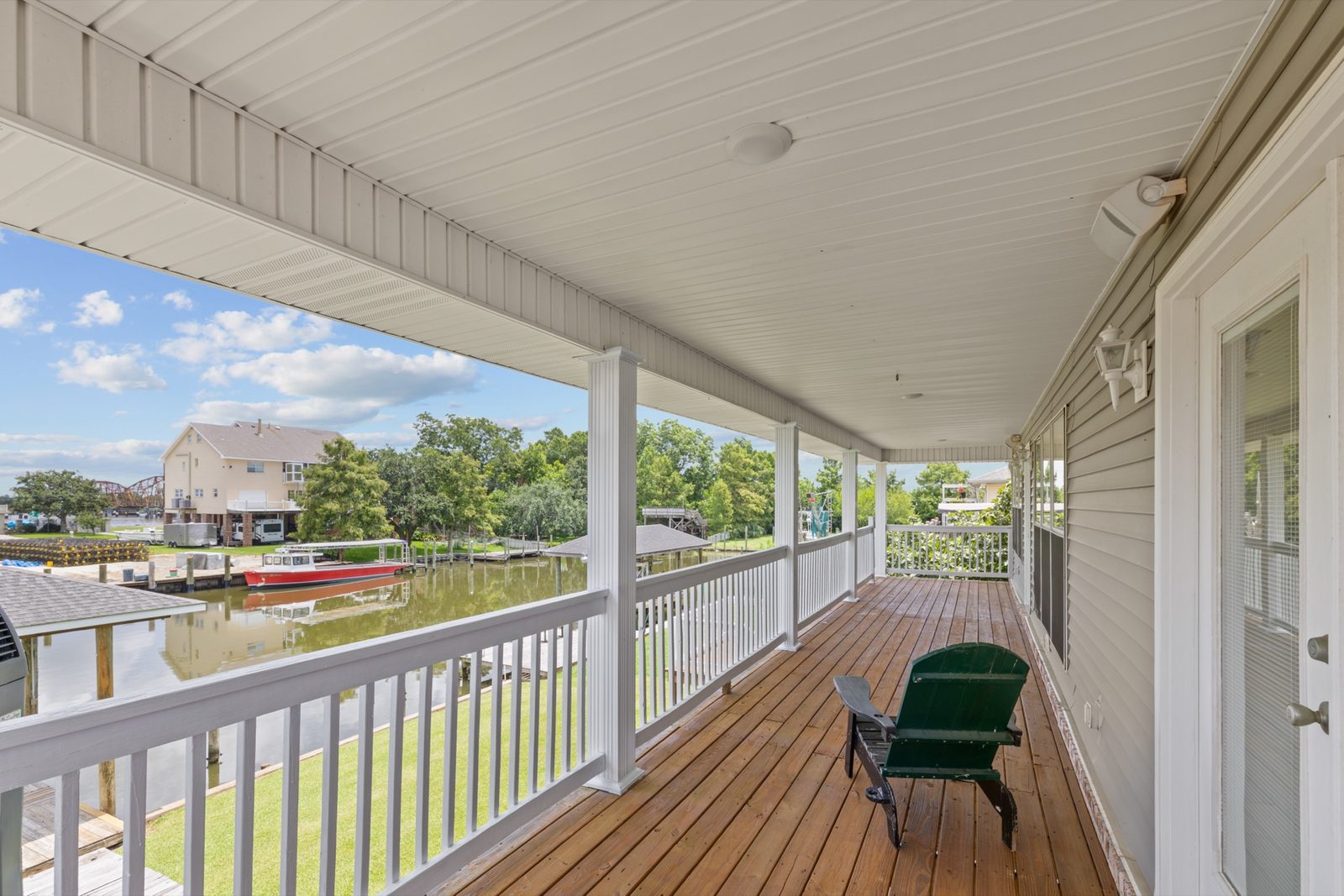 Wood deck with water view at midday